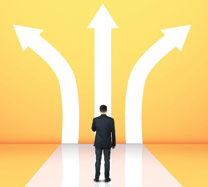 a business man faced with arrows in different directions